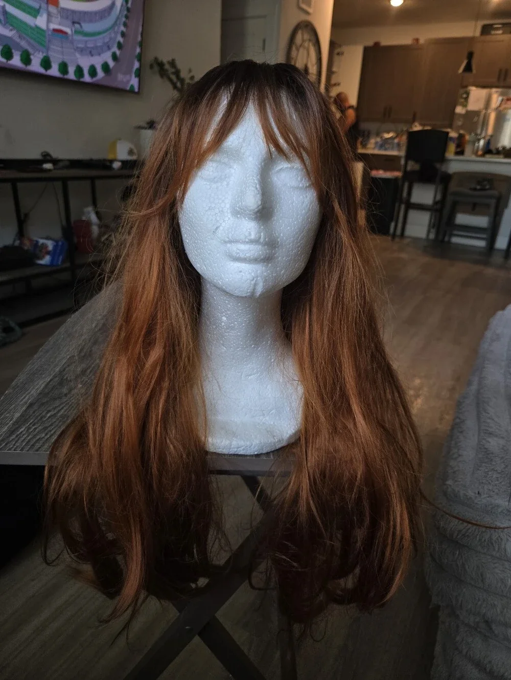 long auburn wig with dark brown roots and face-framing wispy bangs Sunthetic